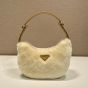 Prada Arqué shearling and leather shoulder bag