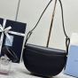 Prada Arqué leather shoulder bag with flap