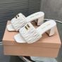 MIU MIU Matelassé nappa leather slides