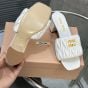 MIU MIU Matelassé nappa leather slides
