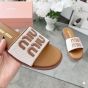 MIU MIU Canvas and leather slides