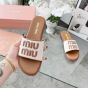 MIU MIU Canvas and leather slides