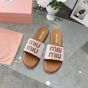 MIU MIU Canvas and leather slides