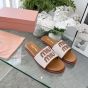 MIU MIU Canvas and leather slides