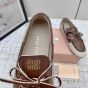MIU MIU Canvas and bleached leather boat shoes