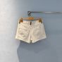 MIU MIU Denim and leather shorts