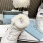 Prada Leather and shearling high-top sneakers