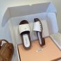 MIU MIU Patent leather clogs