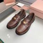 MIU MIU Vintage-effect leather penny loafers