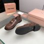 MIU MIU Vintage-effect leather penny loafers