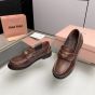 MIU MIU Vintage-effect leather penny loafers