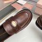MIU MIU Vintage-effect leather penny loafers