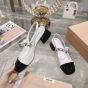 MIU MIU Two-tone patent leather slingback pumps