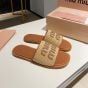 MIU MIU Raffia-effect woven fabric slides