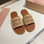 MIU MIU Raffia-effect woven fabric slides