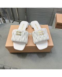 MIU MIU Matelassé nappa leather slides