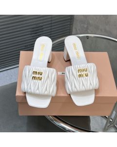 MIU MIU Matelassé nappa leather slides