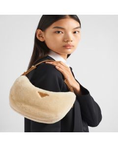 Prada Arqué shearling and leather shoulder bag