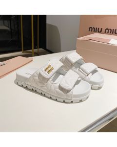 MIU MIU Matelassé nappa leather slides