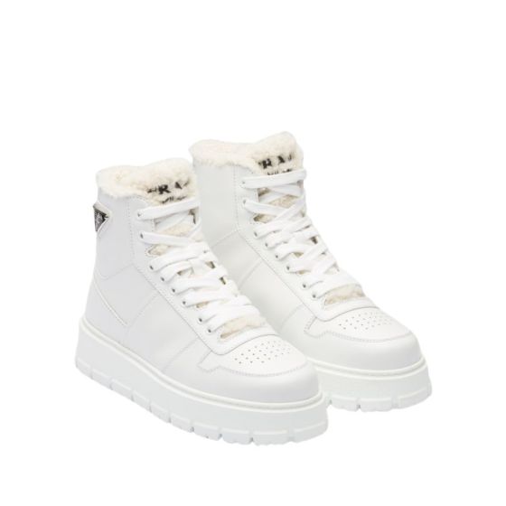 Prada Leather and shearling high-top sneakers