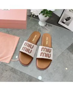 MIU MIU Canvas and leather slides