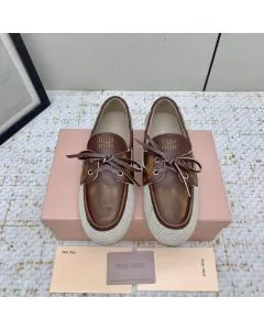 MIU MIU Canvas and bleached leather boat shoes